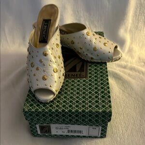 Rene Mancini White and Gold Mules with Intricate Perforations